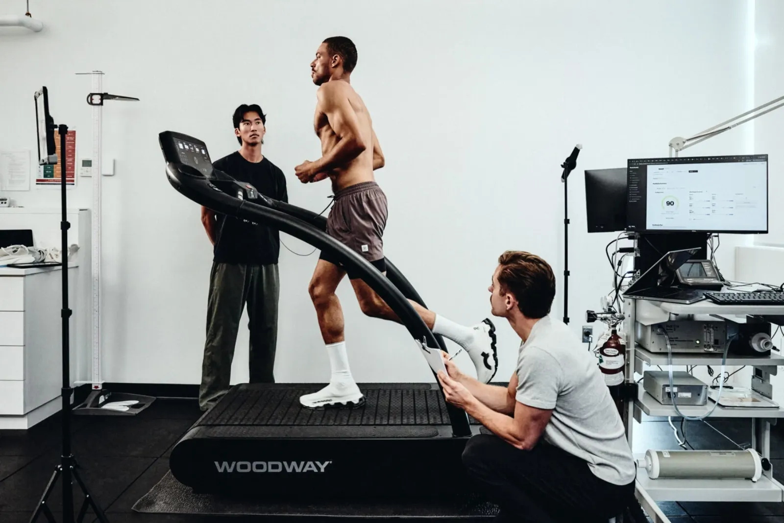 A physiotherapist and a runner on a treadmill during a RunReady assessment